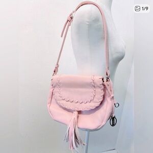 Carlos bubblegum pink vegan leather bag with fringe and silver details.